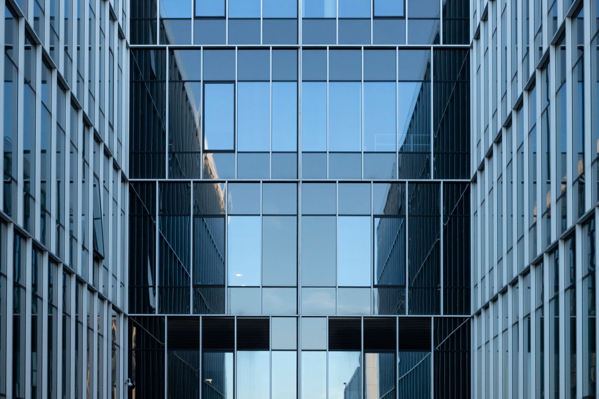 Glass office building with commercial solar window film